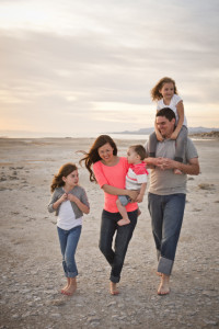 family walking along beach